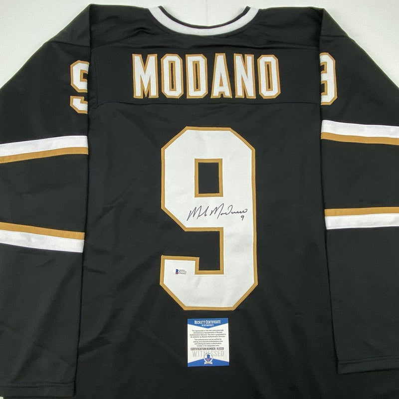 Autographed/Signed Mike Modano Dallas Black Hockey Jersey Beckett BAS COA