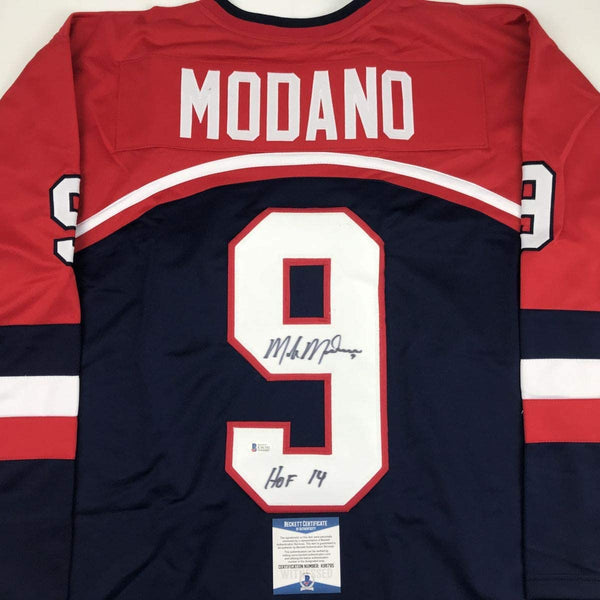 Autographed/Signed Mike Modano HOF 2014 United States USA Blue Hockey Jersey Beckett BAS COA
