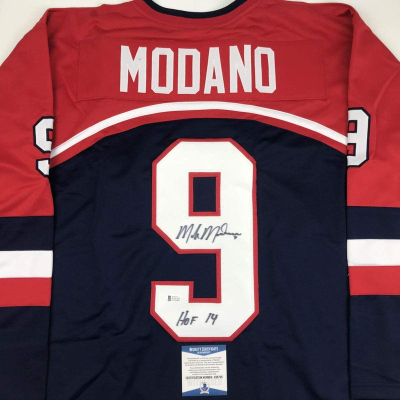 Autographed/Signed Mike Modano HOF 2014 United States USA Blue Hockey Jersey Beckett BAS COA