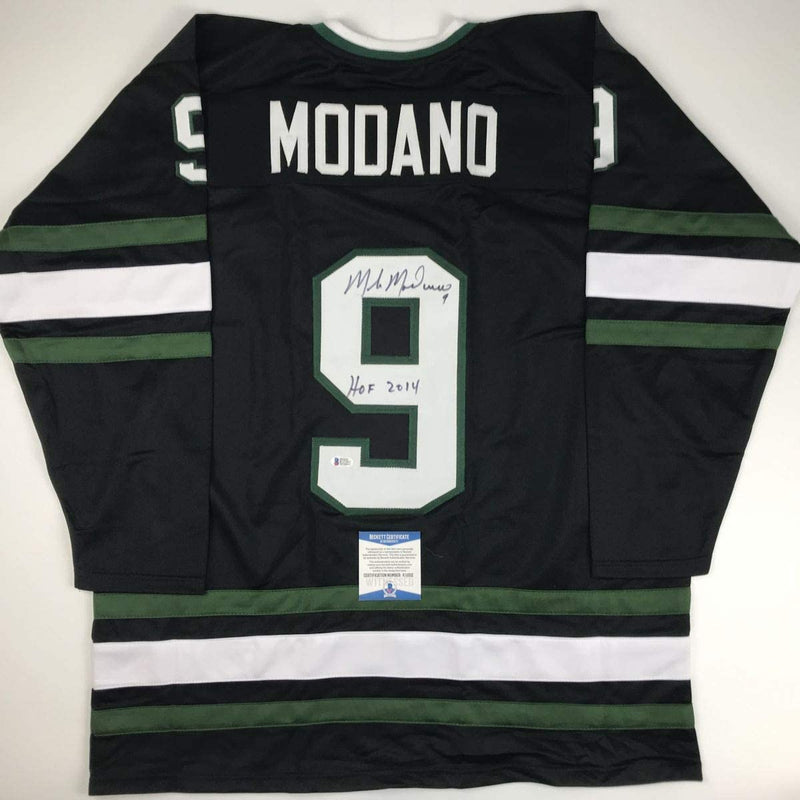 Autographed/Signed Mike Modano HOF 2014 Dallas Black Hockey Jersey Beckett BAS COA