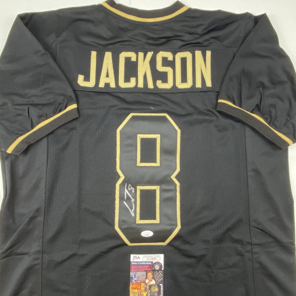 Autographed/Signed Lamar Jackson Baltimore Blackout Football Jersey JSA COA