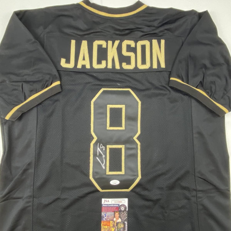 Autographed/Signed Lamar Jackson Baltimore Blackout Football Jersey JSA COA