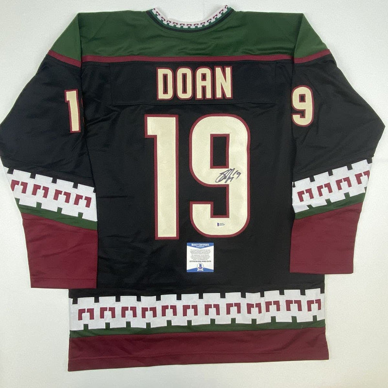 Autographed/Signed Shane Doan Arizona Black Hockey Jersey Beckett BAS COA