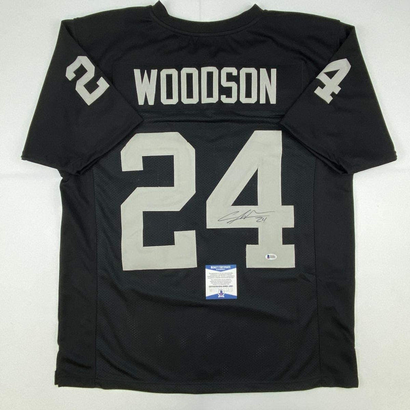 Autographed/Signed Charles Woodson Oakland Black Football Jersey Beckett BAS COA