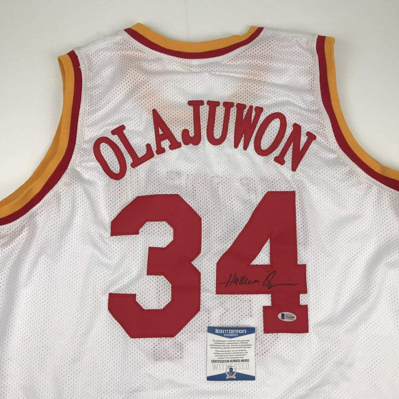 Autographed/Signed Hakeem Olajuwon Houston White Basketball Jersey Beckett BAS COA