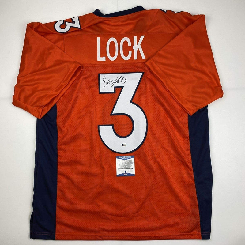 Autographed/Signed Drew Lock Denver Orange Football Jersey Beckett BAS COA