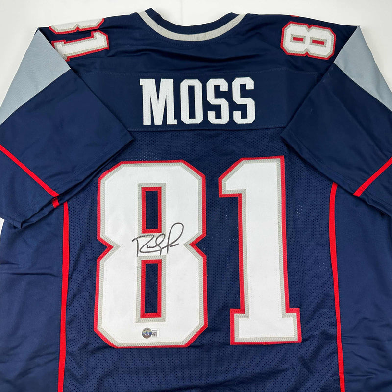 Autographed/Signed Randy Moss New England Blue Football Jersey Beckett BAS COA