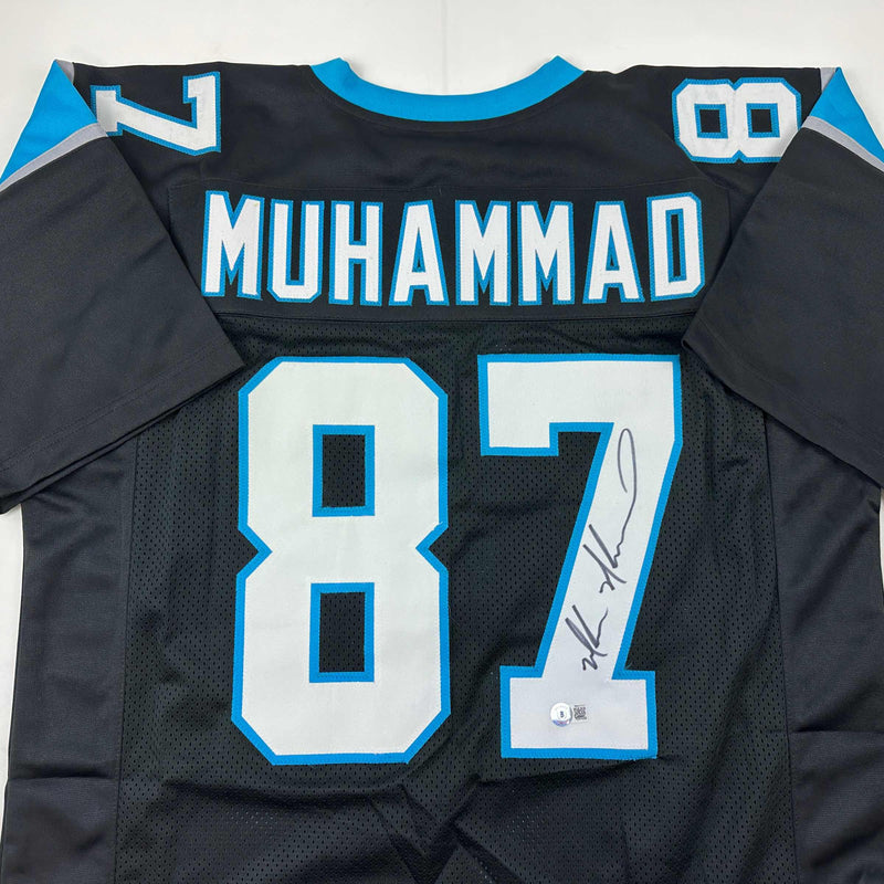 Autographed/Signed Muhsin Muhammad Carolina Black Football Jersey Beckett BAS COA