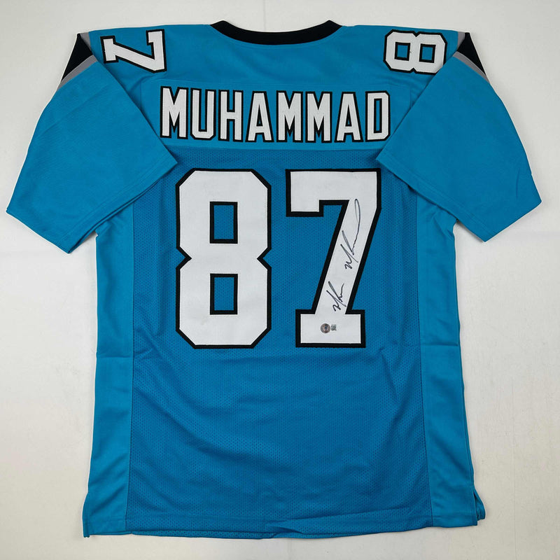 Autographed/Signed Muhsin Muhammad Carolina Blue Football Jersey Beckett BAS COA