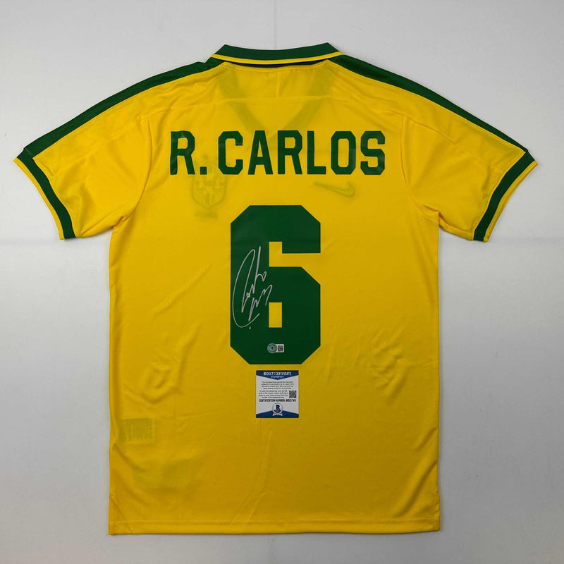 Autographed/Signed Roberto Carlos Brazil Yellow Retro Soccer Jersey Beckett BAS COA