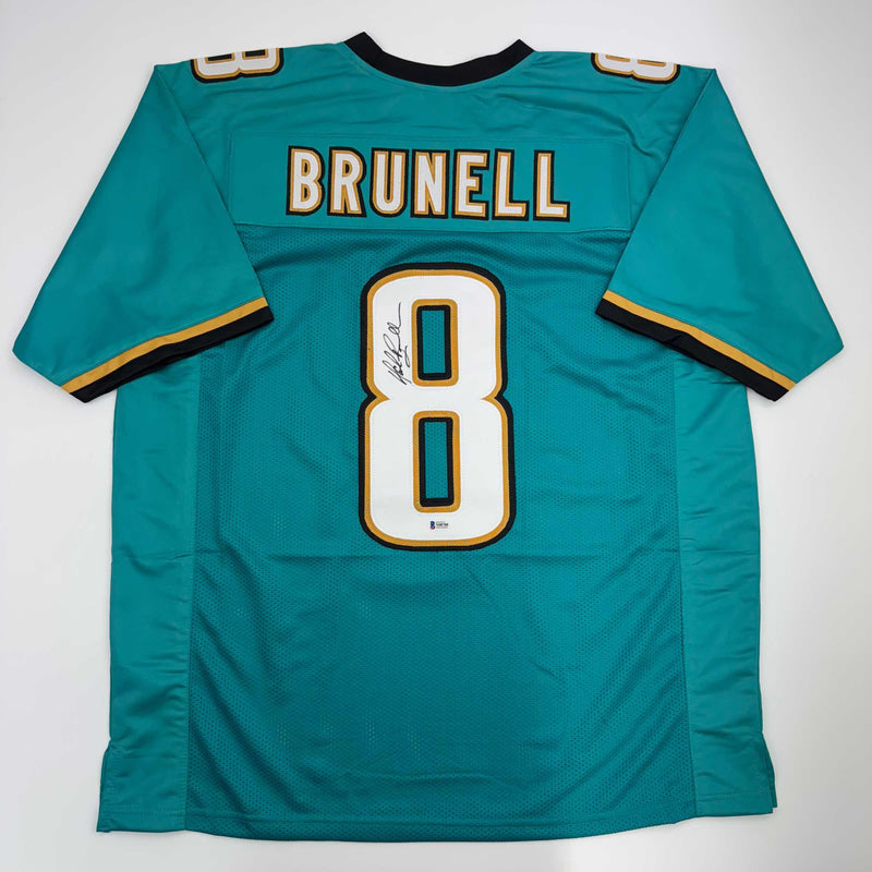 Autographed/Signed Mark Brunell Jacksonville Teal Football Jersey Beckett BAS COA