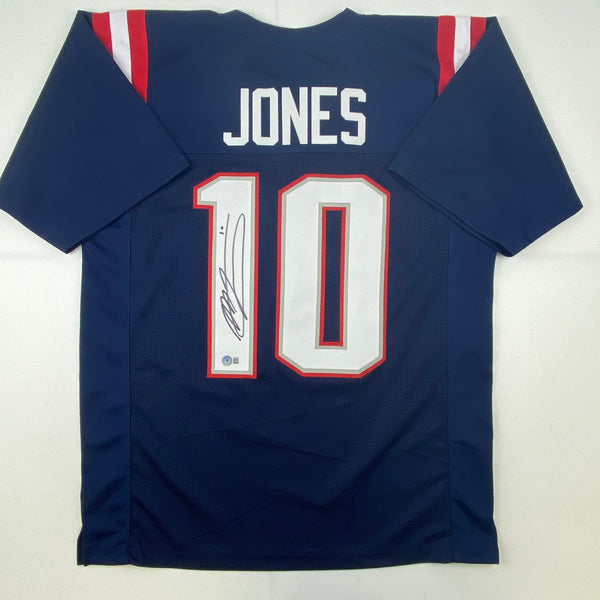 Autographed/Signed Mac Jones New England Blue Football Jersey Beckett BAS COA