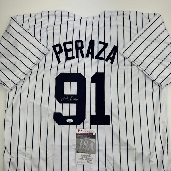 Autographed/Signed Oswald Peraza New York Pinstripe Baseball Jersey JSA COA