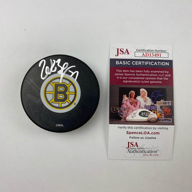 Autographed/Signed Patrice Bergeron Boston Bruins Logo Hockey Puck JSA COA
