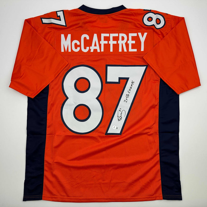 Autographed/Signed Ed McCaffrey 2x SB Champs Denver Orange Football Jersey Beckett BAS COA